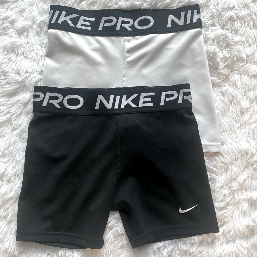 2 pairs of juniors L Nike shorts run Small in women’s